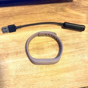 Fitbit Flex2 and charger with small lilac band and necklace